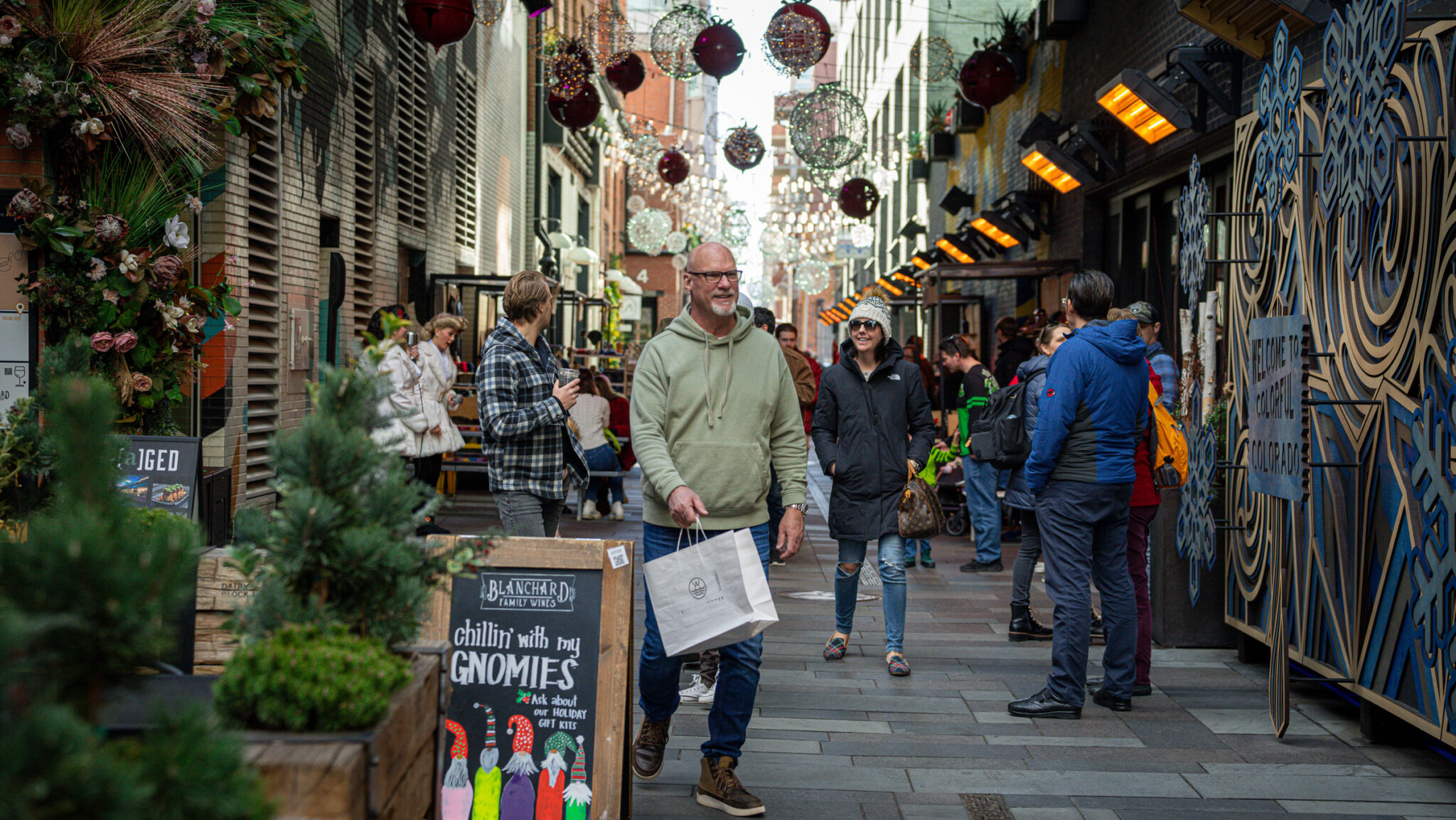 holiday market with shoppers in the dairy block alley