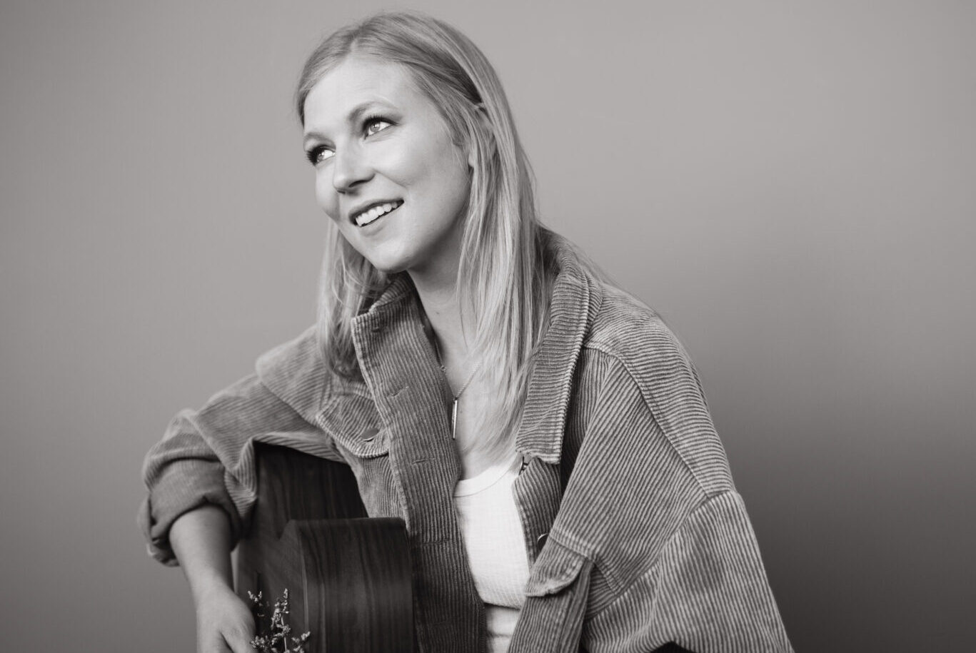 Racyne Parker promo photo with her guitar