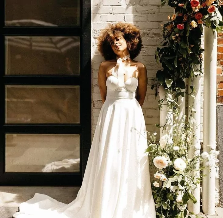 bride wearing grace loves lace wedding gown in dairy block denver