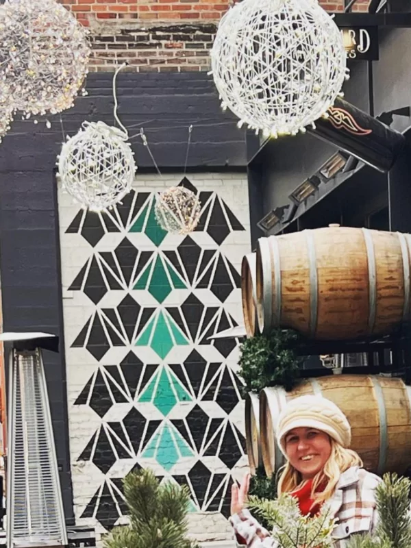 woman smiling in the alley at dairy block denver