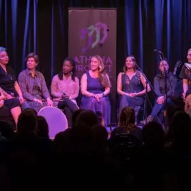 Group of people talking on stage