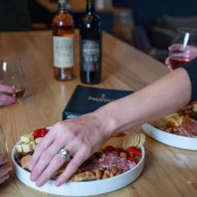 people enjoying wine and charcuterie at blanchard family wines at dairy block denver