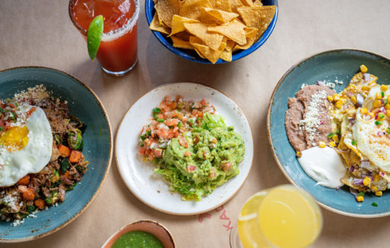 Kachina brunch spread featuring skillets, chiliquiles, and guacamole