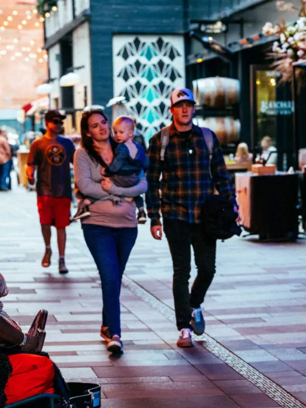 young family browsing the shops at dairy block denver
