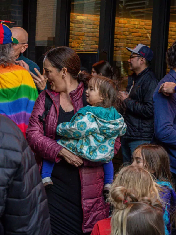 mom holding child at dairy block denver