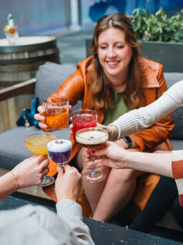 women enjoying craft cocktails at dairy block denver