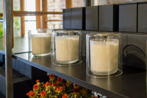 Candles on a display shelf at MENO Home in Denver