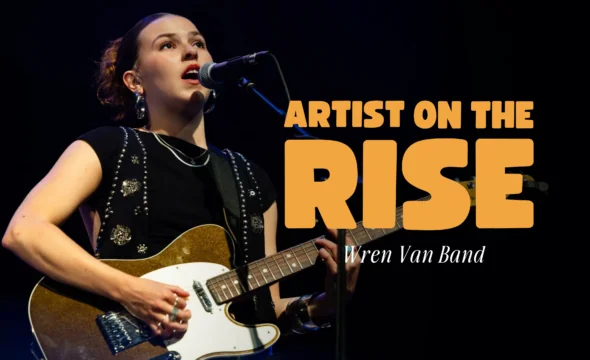 Wren Van Band guitarist performing under 