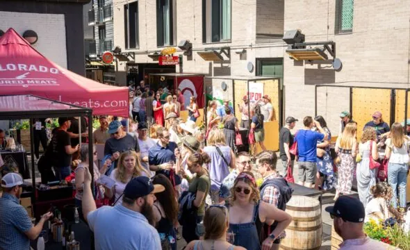 Crowd Gathering at Outdoor Craft Market with Colorado Cured Meats Tent